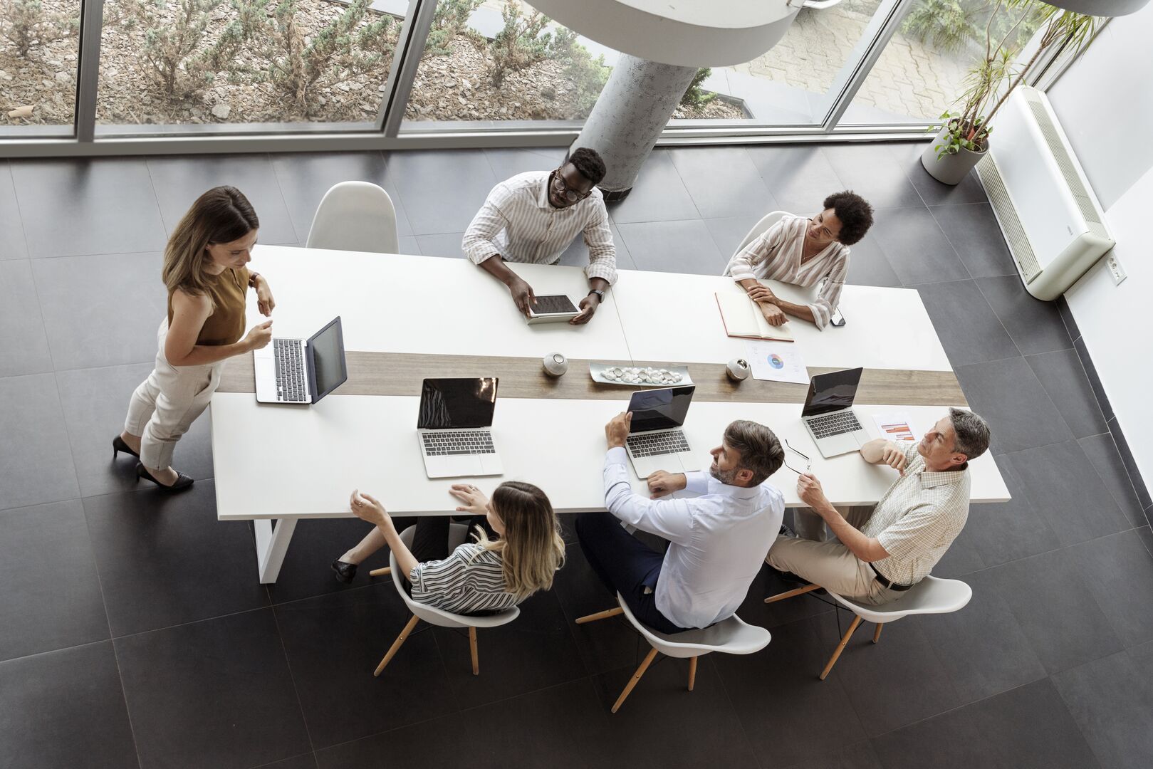Two people discussing a topic infront of a computer